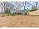 Backyard featuring a storage shed, a wooden fence, and natural ground cover, providing practical outdoor storage at 389 Kendrick Se Ave, Atlanta, GA 30315