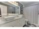 Full bathroom featuring double sinks, marble countertop, and gray walls at 389 Kendrick Se Ave, Atlanta, GA 30315