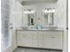Beautiful bathroom featuring a marble countertop, white cabinets and double sinks at 389 Kendrick Se Ave, Atlanta, GA 30315