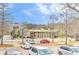 View of the building with many cars parked in the parking lot on a partly cloudy day at 389 Kendrick Se Ave, Atlanta, GA 30315