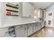 Bright kitchen features white cabinetry, subway tile backsplash, and hardwood flooring at 389 Kendrick Se Ave, Atlanta, GA 30315
