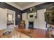 Comfortable living room with fireplace, hardwood floors, and doorway to another living area at 389 Kendrick Se Ave, Atlanta, GA 30315