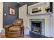 Living room features a fireplace with green tile surround and an inviting leather chair at 389 Kendrick Se Ave, Atlanta, GA 30315