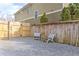Gravel side yard with a wooden fence and furniture, perfect for enjoying outdoor relaxation and privacy at 389 Kendrick Se Ave, Atlanta, GA 30315