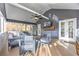 Comfortable screened porch featuring gray furniture, ceiling fan, and mounted TV for relaxing and entertaining at 389 Kendrick Se Ave, Atlanta, GA 30315