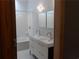 Modern bathroom with double sinks and white tile at 48 Moury Se Ave, Atlanta, GA 30315