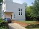 Modern white house with a landscaped yard and driveway at 48 Moury Se Ave, Atlanta, GA 30315