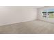 Bright bedroom featuring neutral walls and carpet at 5435 Flat Rock Pt, Stonecrest, GA 30038