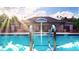 Refreshing community pool with a covered seating area at 5435 Flat Rock Pt, Stonecrest, GA 30038
