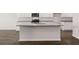 Modern kitchen with white cabinets and granite countertops at 5435 Flat Rock Pt, Stonecrest, GA 30038