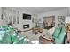 Bright living room featuring built-in cabinets, hardwood floors, and fireplace, and white walls with plenty of natural light at 115 17Th Ne St, Atlanta, GA 30309