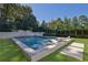 Modern rectangular pool with built-in seating and waterfall feature at 115 17Th Street Ne, Atlanta, GA 30309