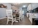 Bright dining room with farmhouse table and bench seating, open to kitchen at 2322 Sheridan Ct, Villa Rica, GA 30180