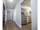 Light and bright entry hall with vinyl flooring and access to kitchen at 2322 Sheridan Ct, Villa Rica, GA 30180