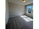 Well-lit bedroom with carpet flooring and a large window at 269 Lakeside Pl, Canton, GA 30114