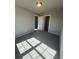 Bright bedroom with carpet, large window, and ample closet space at 269 Lakeside Pl, Canton, GA 30114