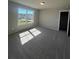 Spacious bedroom featuring a large window and a walk-in closet at 269 Lakeside Pl, Canton, GA 30114