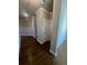 Hardwood floors and neutral walls in a bright hallway at 269 Lakeside Pl, Canton, GA 30114