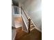 Elegant staircase with hardwood floors and white railings at 269 Lakeside Pl, Canton, GA 30114