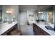 Serene bathroom with dual vanities, freestanding tub, glass shower, and modern finishes at 11360 Bennett Ln, Johns Creek, GA 30097