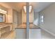 Bright bathroom featuring double vanity, marble flooring, and modern lighting fixtures at 11360 Bennett Ln, Johns Creek, GA 30097