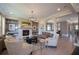 Bright living room with stone fireplace, built-in shelving, and hardwood floors at 11360 Bennett Ln, Johns Creek, GA 30097
