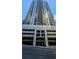 High-rise building exterior with parking and street view at 1280 W Peachtree W St # 1407, Atlanta, GA 30309
