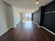 Bright and spacious living room with dark hardwood floors and large windows at 1280 W Peachtree W St # 1407, Atlanta, GA 30309