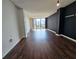 Bright and spacious living room with dark hardwood floors and large windows at 1280 W Peachtree W St # 1407, Atlanta, GA 30309