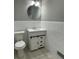 Updated bathroom with a white vanity, subway tile, and new flooring at 2812 Arlington Rd, Atlanta, GA 30344