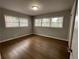 Bright bedroom with hardwood floors and multiple windows at 2812 Arlington Rd, Atlanta, GA 30344