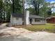 Rear view of a charming ranch house with a newly paved driveway at 2812 Arlington Rd, Atlanta, GA 30344
