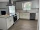 Modern kitchen with white cabinets, granite countertops, and stainless steel appliances at 2812 Arlington Rd, Atlanta, GA 30344