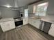 Modern kitchen with white cabinets, granite countertops, and stainless steel appliances at 2812 Arlington Rd, Atlanta, GA 30344