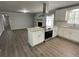 Modern kitchen with white cabinets, granite countertops, and stainless steel appliances at 2812 Arlington Rd, Atlanta, GA 30344