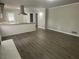 Open concept kitchen and living area with stainless steel appliances and hardwood floors at 2812 Arlington Rd, Atlanta, GA 30344