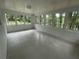 Bright sunroom with white brick walls and a patterned floor, offering ample natural light at 2812 Arlington Rd, Atlanta, GA 30344