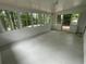 Sunroom with white brick walls, patterned flooring, and access to the backyard at 2812 Arlington Rd, Atlanta, GA 30344