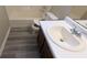 Clean bathroom with updated vanity and bathtub at 6627 Coventry Pt, Austell, GA 30168