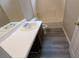 Clean bathroom with single vanity and tub at 6627 Coventry Pt, Austell, GA 30168