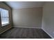 Simple bedroom with large window and carpet at 6627 Coventry Pt, Austell, GA 30168