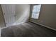 Bright bedroom featuring carpet and a window at 6627 Coventry Pt, Austell, GA 30168