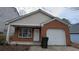 Front view of a ranch home with brick and siding exterior, and an attached garage at 6627 Coventry Pt, Austell, GA 30168