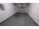 Attached garage with painted floor and automatic door at 6627 Coventry Pt, Austell, GA 30168