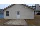 Back of house with a white door and small patio at 6627 Coventry Pt, Austell, GA 30168