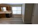 Kitchen with wood cabinets, white countertops and vinyl flooring at 6627 Coventry Pt, Austell, GA 30168