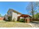 Spacious backyard boasts a covered patio, perfect for outdoor living and entertaining at 10252 Commons Xing, Jonesboro, GA 30238