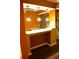 Wet bar with granite countertop, sink, and pendant lighting at 10252 Commons Xing, Jonesboro, GA 30238