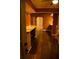 View of basement with hardwood floors and stone countertops on built-in bar area at 10252 Commons Xing, Jonesboro, GA 30238