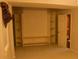 Basement with built-in entertainment center and shelves at 10252 Commons Xing, Jonesboro, GA 30238